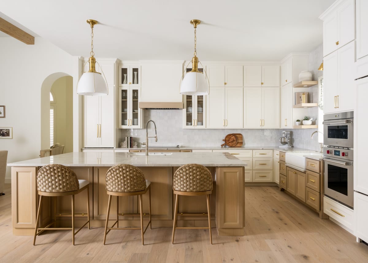 Bright custom kitchen with a large marble island